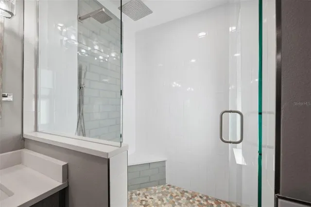 a kitchen with stainless steel appliances a sink and cabinets