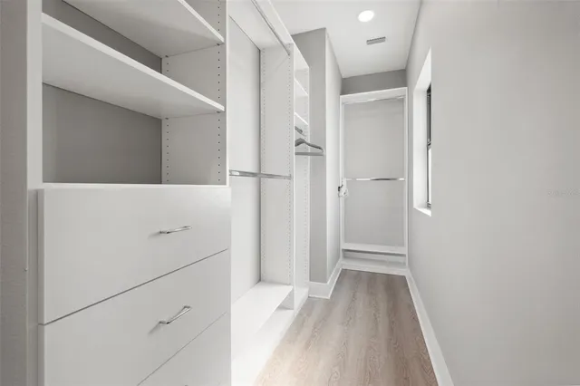 a kitchen with lots of counter top space sink and cabinets