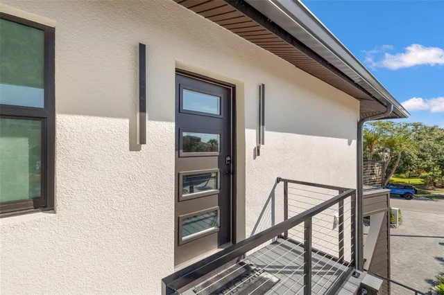 a large kitchen with a large counter top space and stainless steel appliances