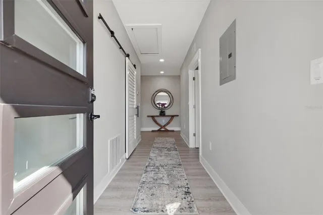 a kitchen with stainless steel appliances granite countertop a refrigerator a stove and a sink