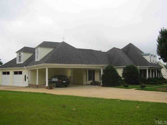 3909 East Valley Court Raleigh, NC 27606 - Photo 1 of 1 FRONT OF HOME W/LANDSCAPED YARD