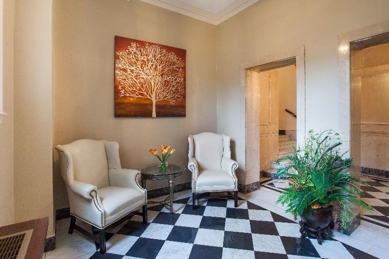 1401 Beacon Street, Unit 704 Brookline, MA 02446 - Photo 3 of 11 a living room with furniture and a potted plant