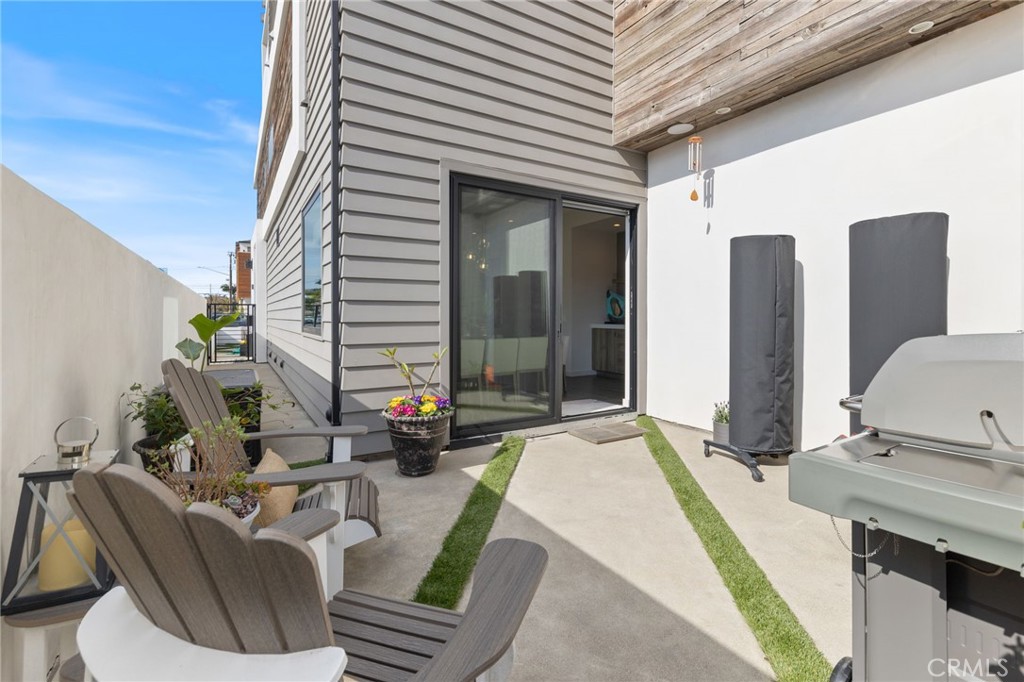1002 Huntington Street Huntington Beach, CA 92648 - Photo 11 of 43 a front view of a house with outdoor seating