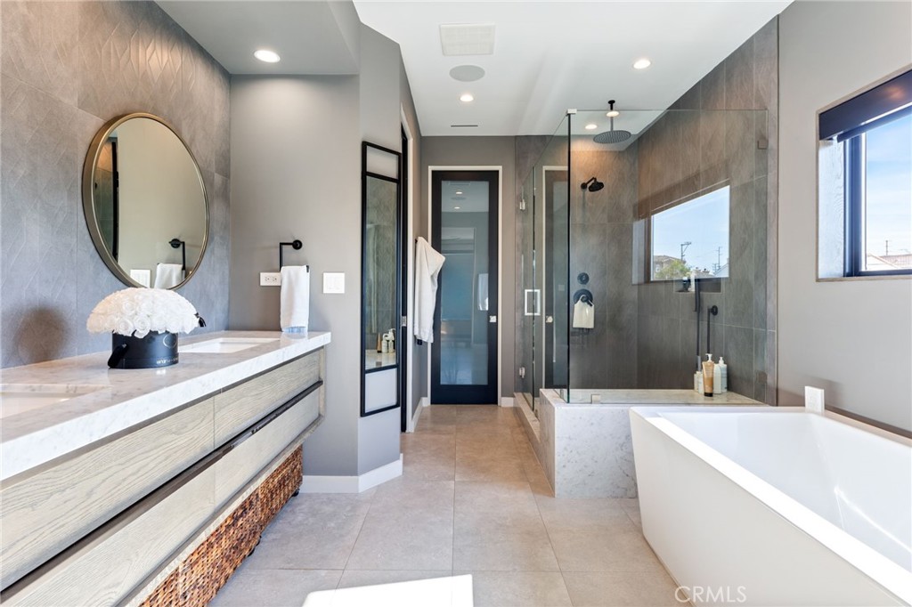 1002 Huntington Street Huntington Beach, CA 92648 - Photo 25 of 43 a large spacious bathroom with a large tub shower and sink
