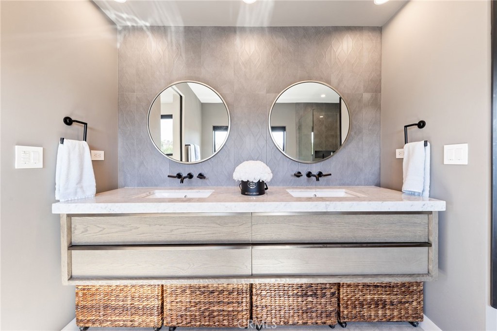 1002 Huntington Street Huntington Beach, CA 92648 - Photo 26 of 43 a bathroom with a double vanity sink and a mirror