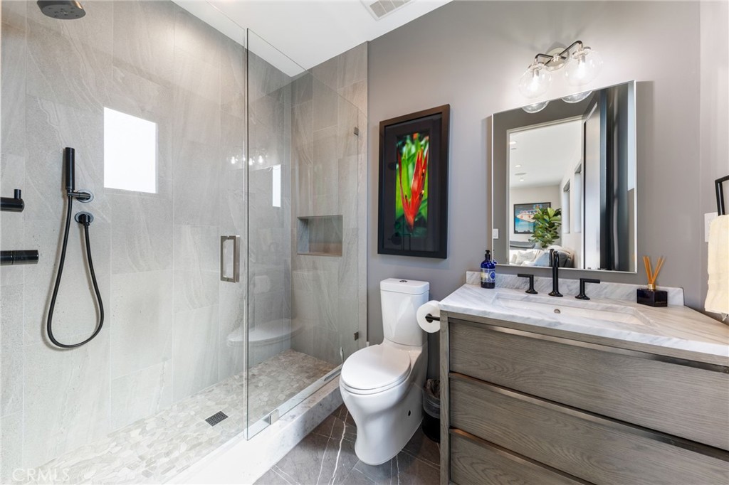 1002 Huntington Street Huntington Beach, CA 92648 - Photo 31 of 43 a bathroom with a toilet sink and shower