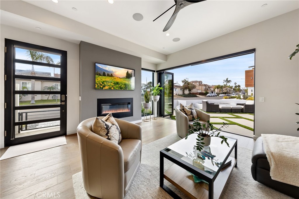 1002 Huntington Street Huntington Beach, CA 92648 - Photo 5 of 43 a living room with furniture and a flat screen tv
