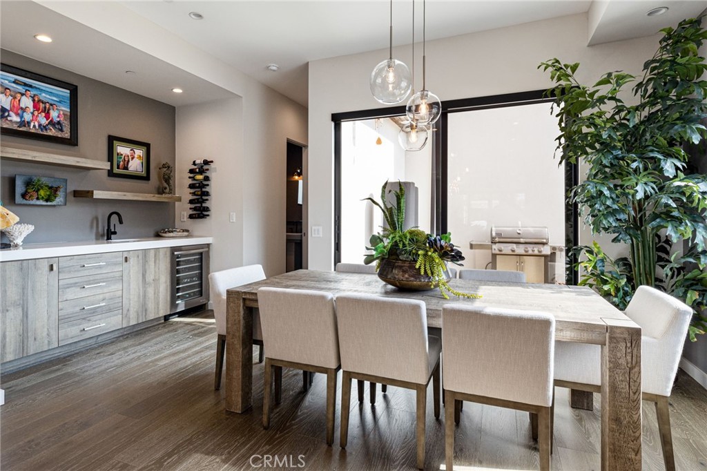 1002 Huntington Street Huntington Beach, CA 92648 - Photo 10 of 43 a dining room with furniture a livingroom and chandelier