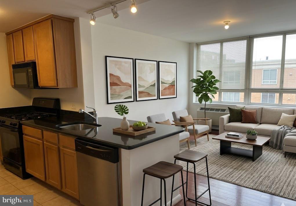 355 I Street Southwest, Unit 626 Washington, DC 20024 - Photo 12 of 37 a kitchen with a stove a sink and a refrigerator