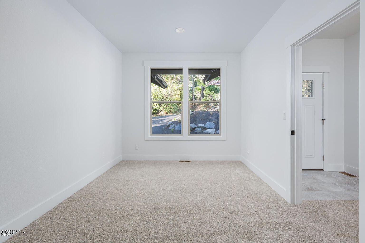 15 Big Tree Road Gleneden Beach, OR 97388 - Photo 16 of 28 a view of an empty room with a window