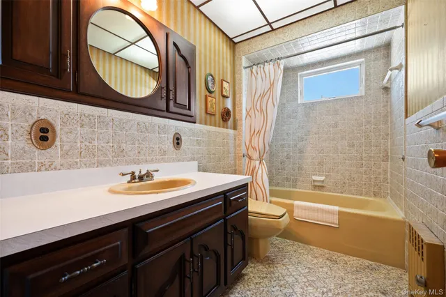 a bathroom with a sink a toilet and a bathtub