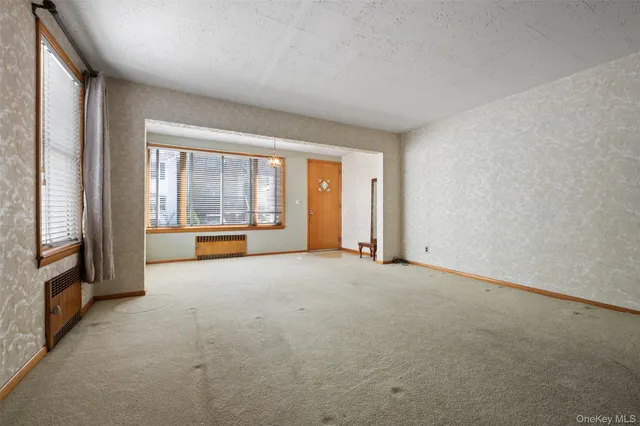 an empty room with entrance door