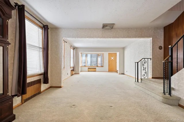 a big room with windows and closet