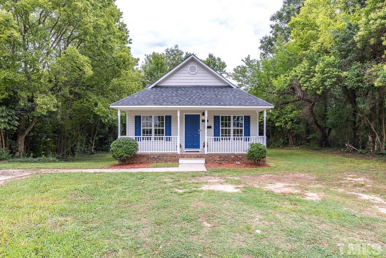 704 Hartford Road Raleigh, NC 27610 - Photo 1 of 29 a front view of a house with a yard table and chairs