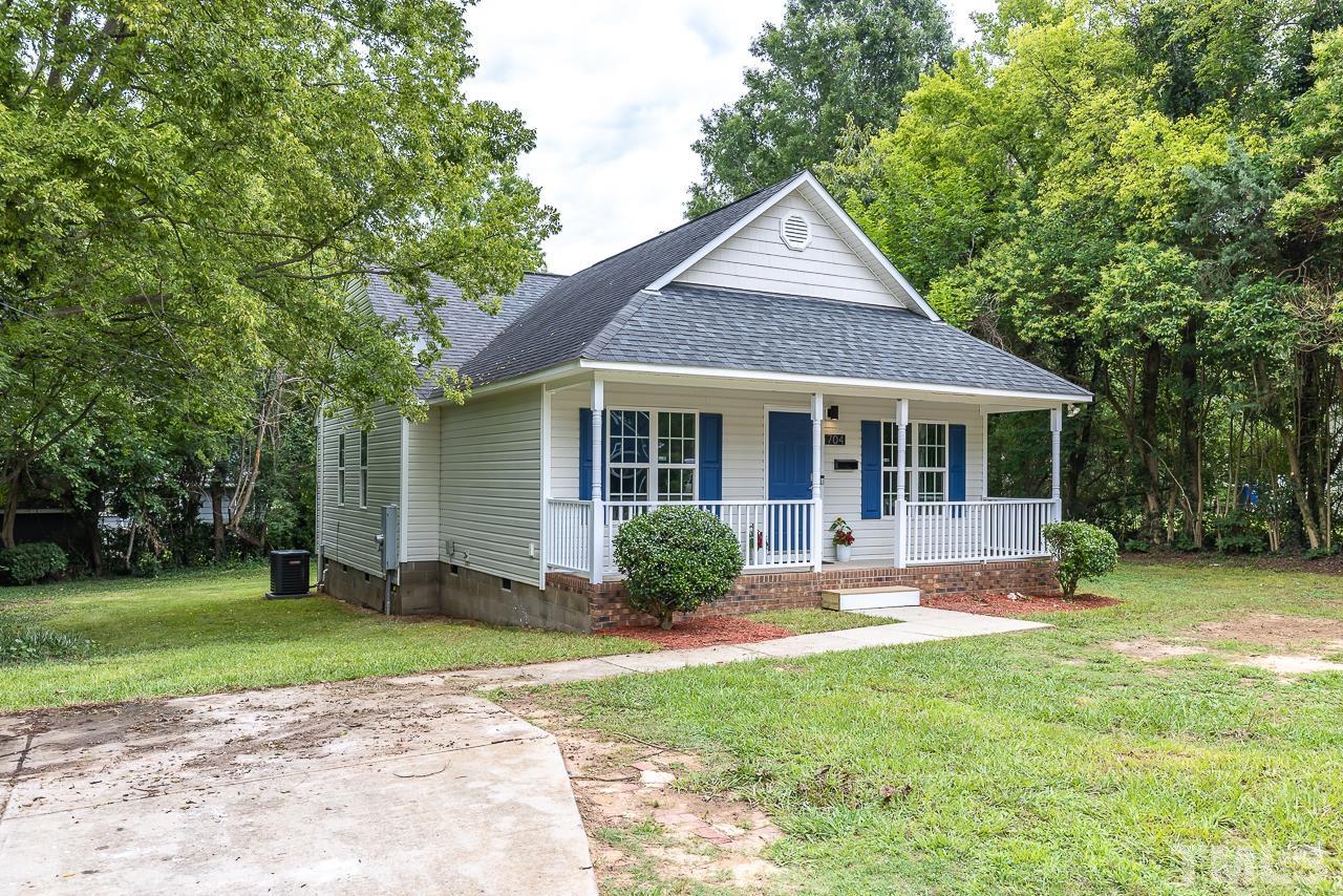 704 Hartford Road Raleigh, NC 27610 - Photo 2 of 29 a front view of a house with a yard and porch