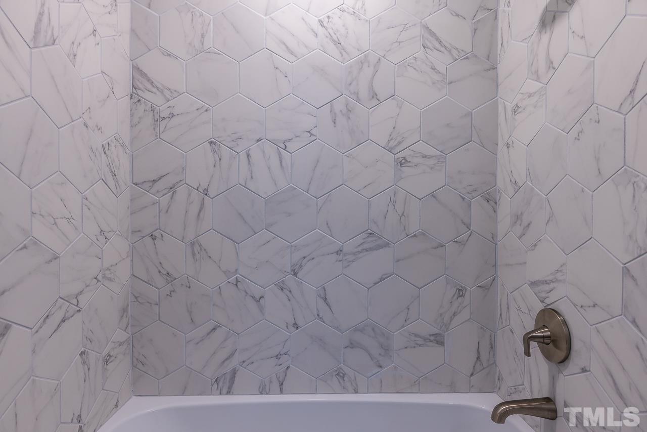 704 Hartford Road Raleigh, NC 27610 - Photo 23 of 29 a bathroom with a shower