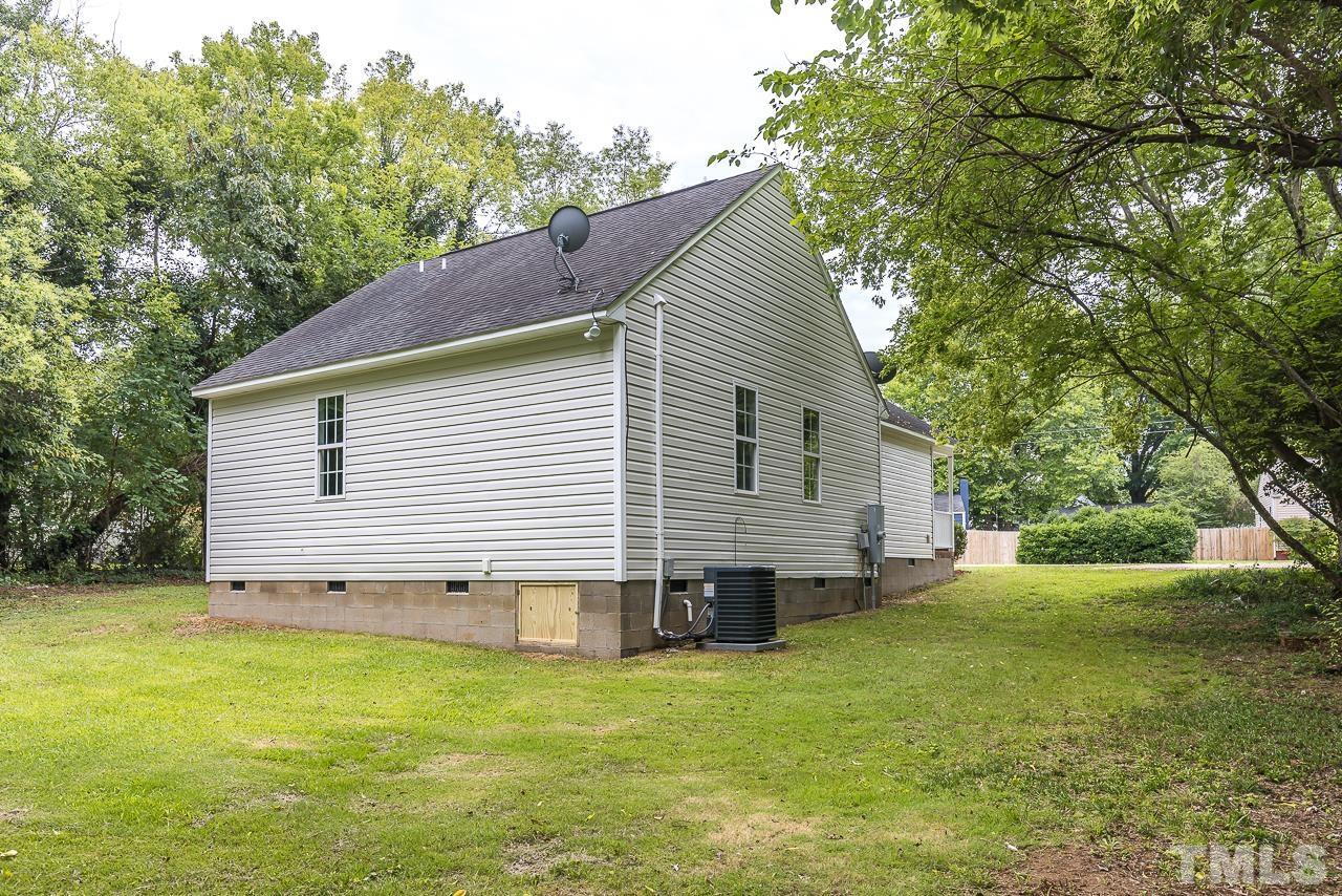 704 Hartford Road Raleigh, NC 27610 - Photo 25 of 29 a view of a house with a yard