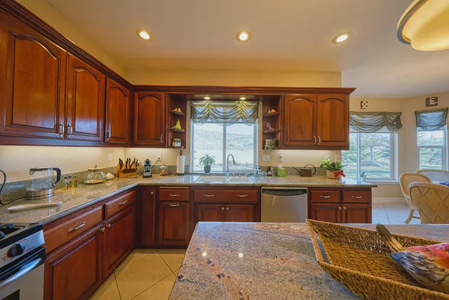a kitchen with lots of counter top space and appliances
