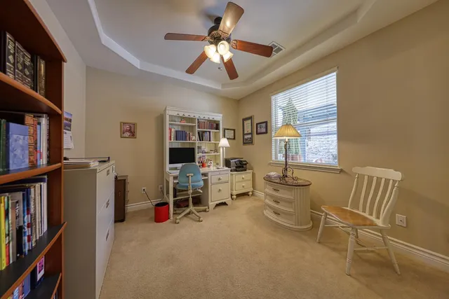 a view of a livingroom with furniture and a window