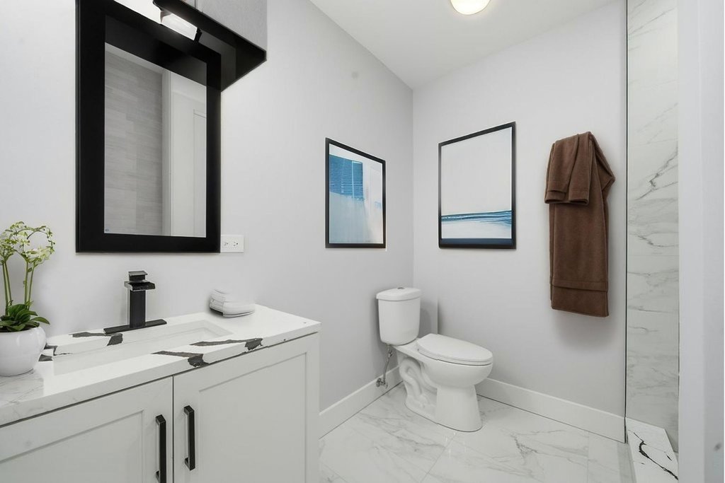 2112 Market Street Blue Island, IL 60406 - Photo 15 of 55 a bathroom with a toilet sink and mirror