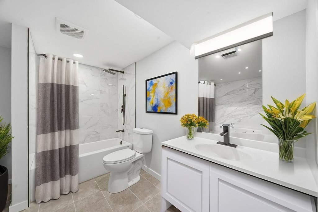 2112 Market Street Blue Island, IL 60406 - Photo 35 of 55 a bathroom with a sink a toilet and a large mirror