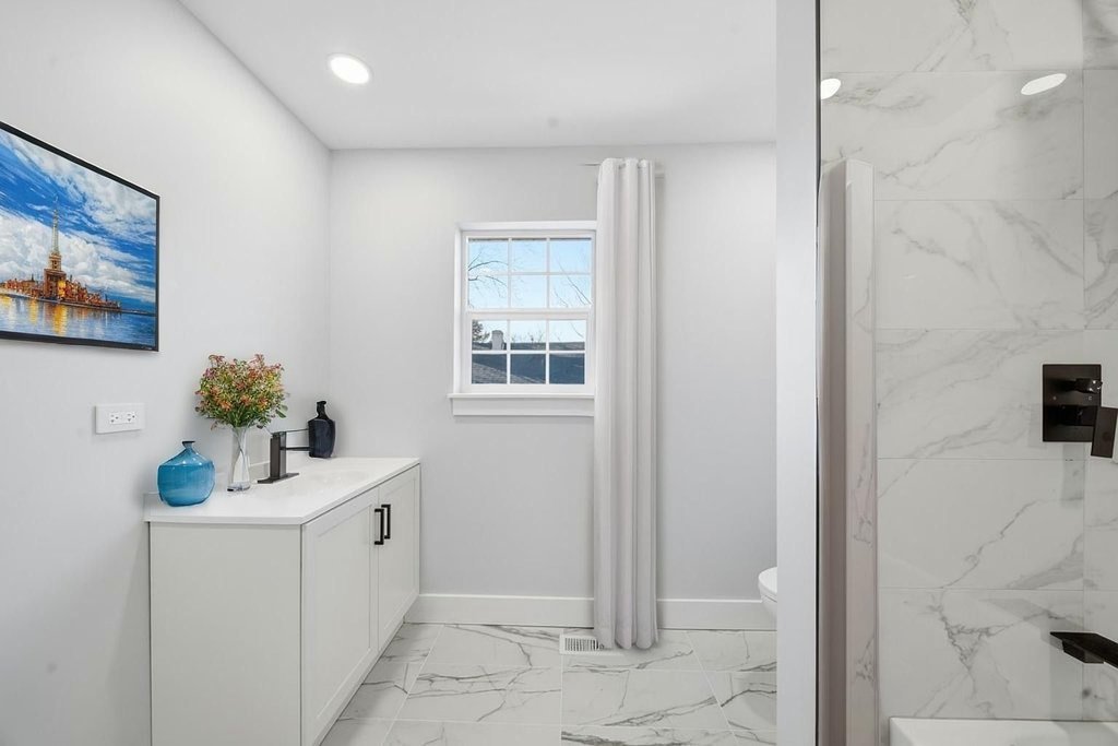 2112 Market Street Blue Island, IL 60406 - Photo 40 of 55 a bathroom with a sink mirror and window