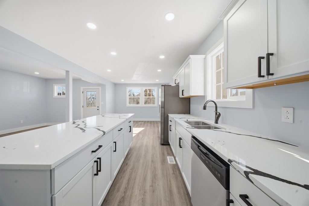 2112 Market Street Blue Island, IL 60406 - Photo 10 of 55 a spacious bathroom with a granite countertop sink a mirror and a bathtub