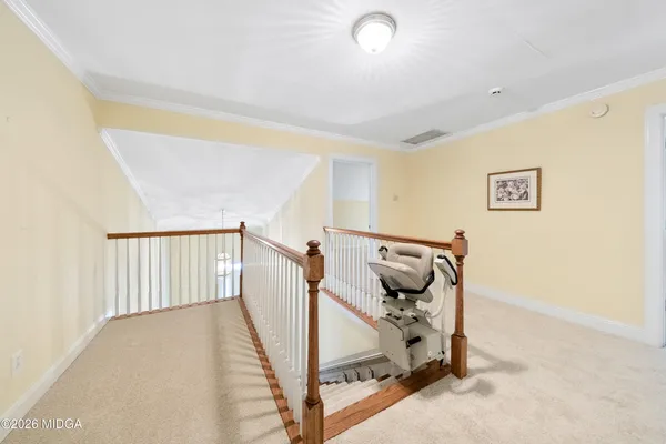 a view of a hallway with staircase