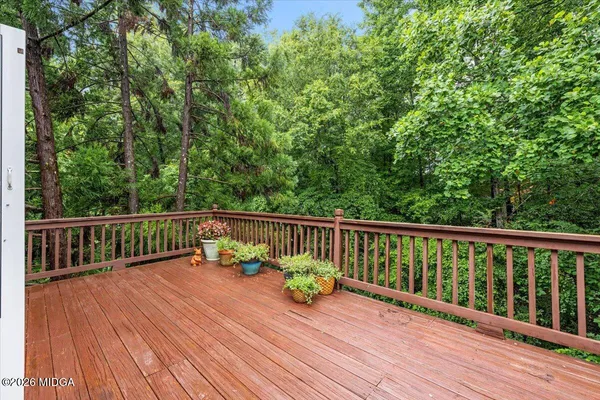 a view of balcony with wooden floor