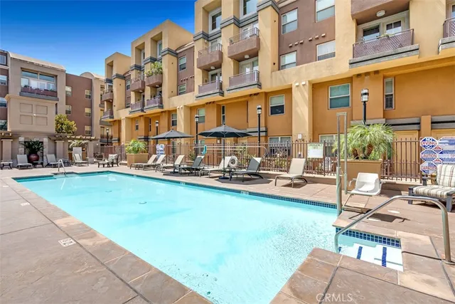 a view of a patio with couches chairs and a fire pit