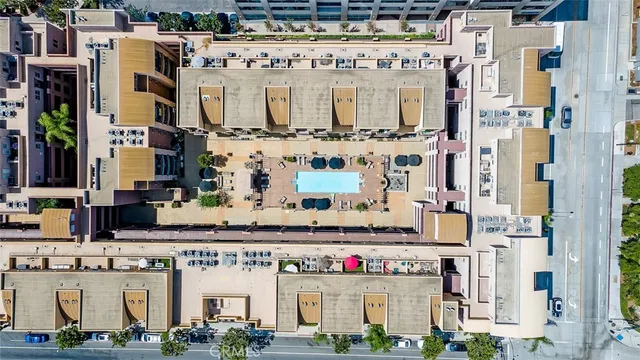 a hallway with white cabinets and wooden floor