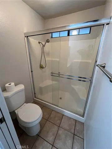 a view of an empty room and a window