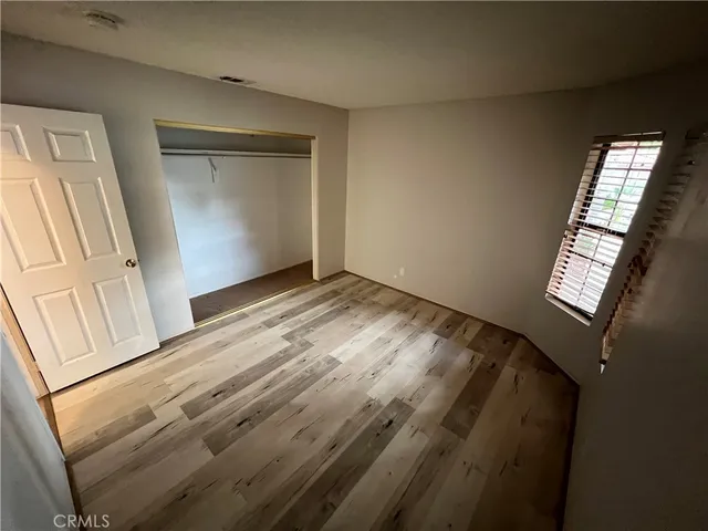a view of a backyard with large trees