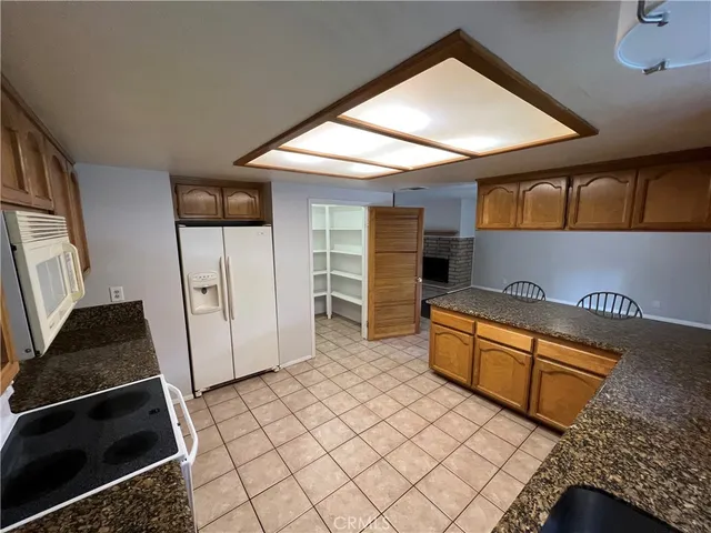 a view of an empty room and wooden floor