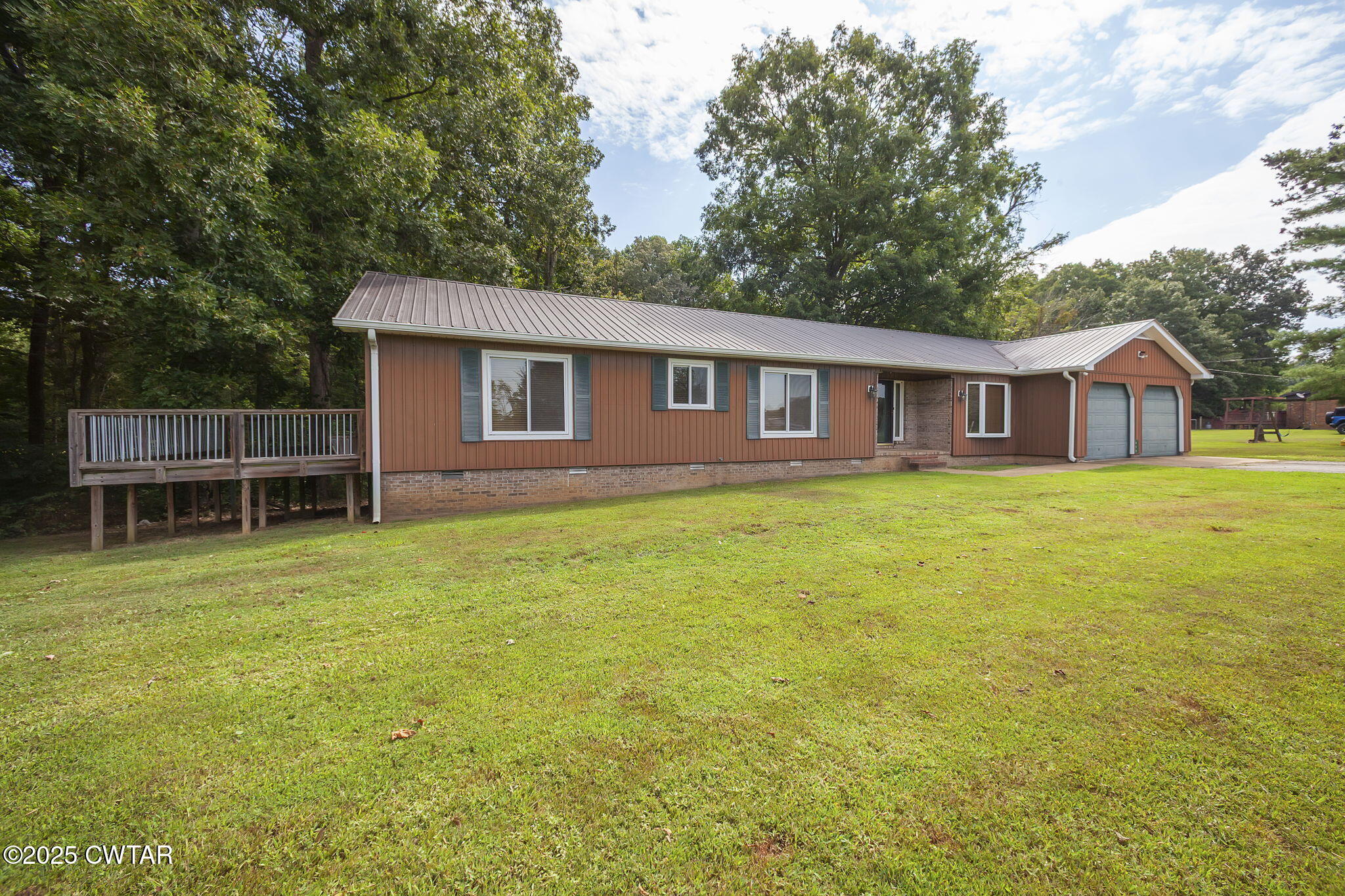 499 Diamond Grove Road Beech Bluff, TN 38313 - Photo 2 of 28 a house view with a garden space