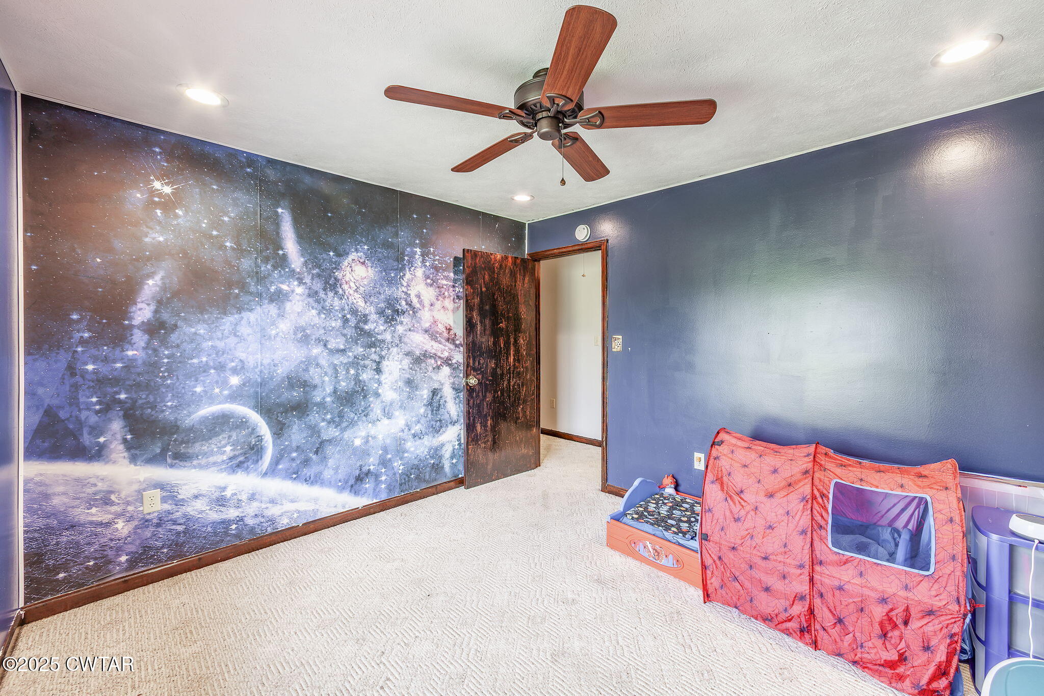 499 Diamond Grove Road Beech Bluff, TN 38313 - Photo 23 of 28 a bedroom with a bed and a chandelier
