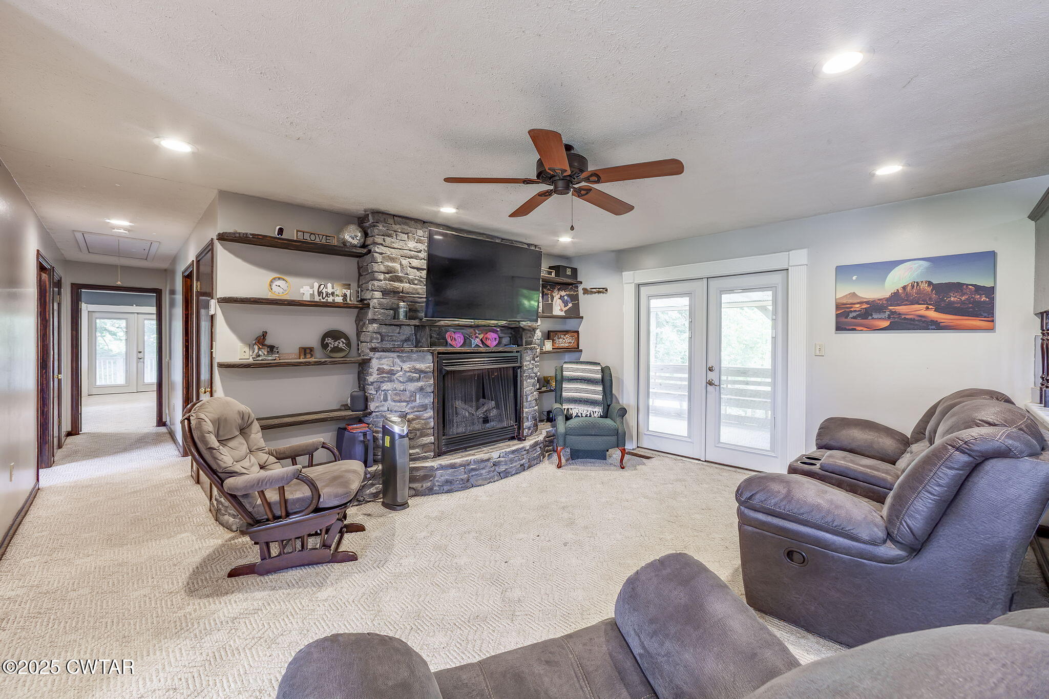 499 Diamond Grove Road Beech Bluff, TN 38313 - Photo 6 of 28 a living room with furniture a fireplace and a flat screen tv