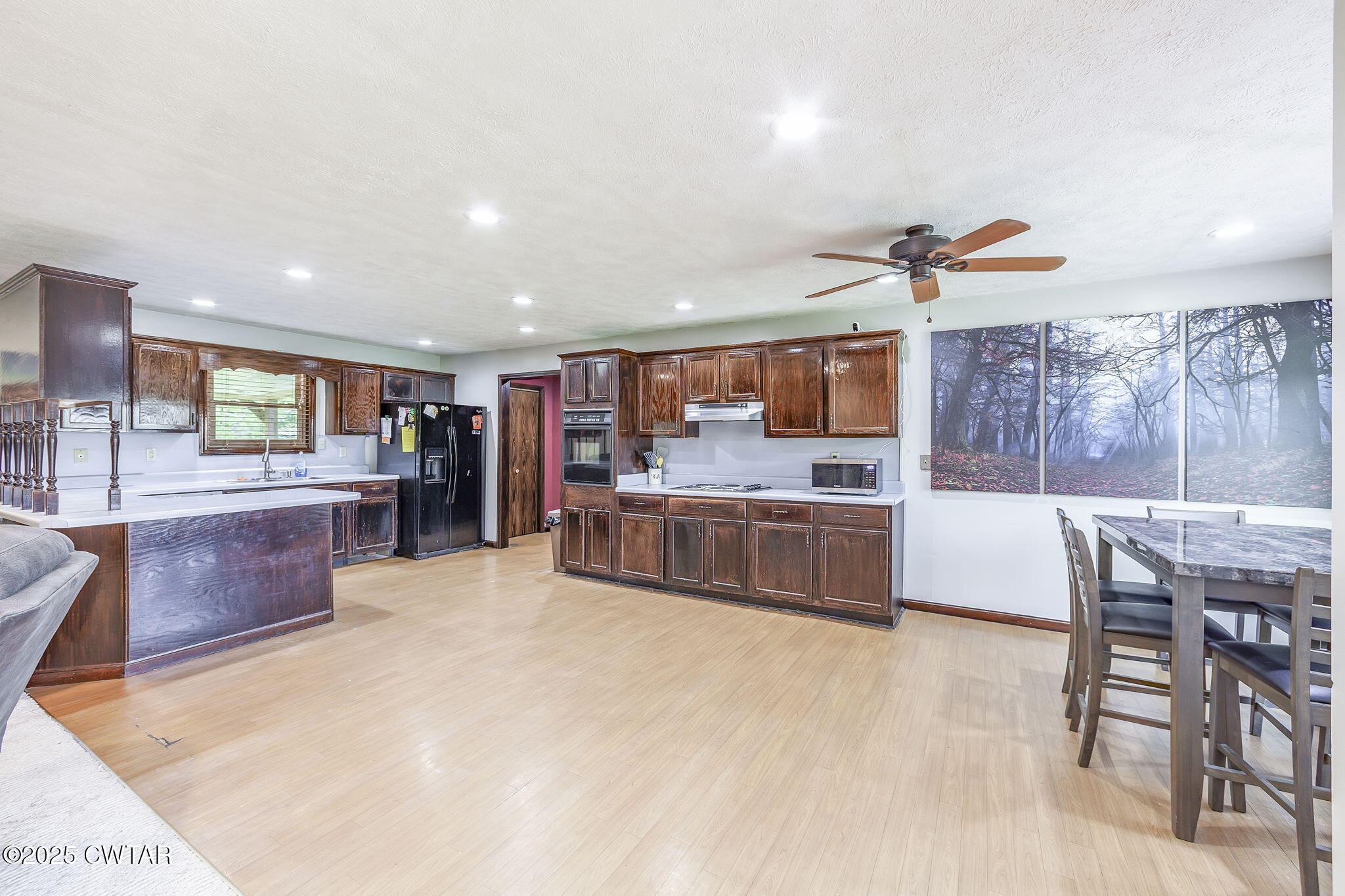 499 Diamond Grove Road Beech Bluff, TN 38313 - Photo 8 of 28 a large kitchen with a table and chairs in it