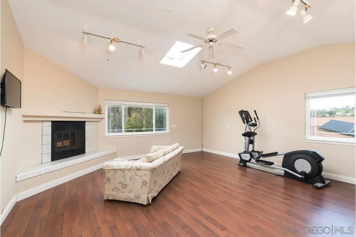 9399 Weber Court Spring Valley, CA 91977 - Photo 15 of 41 a living room with furniture and a fireplace