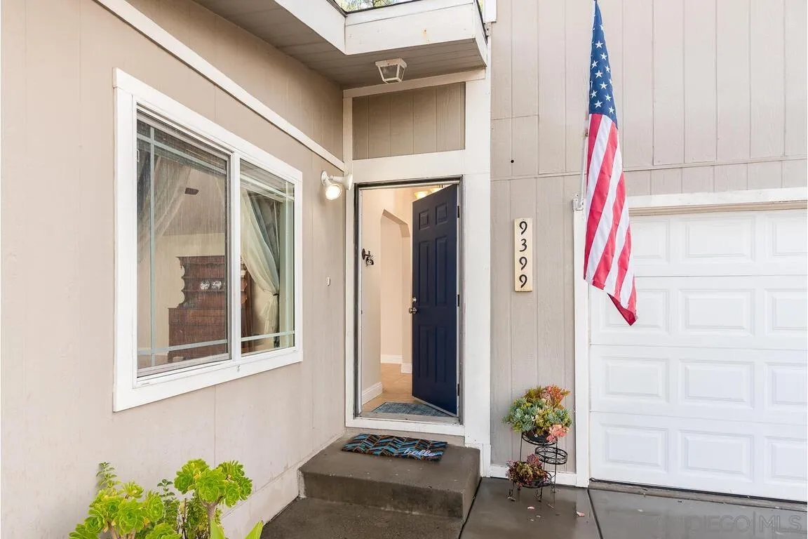 9399 Weber Court Spring Valley, CA 91977 - Photo 2 of 41 a front view of a house with a potted plant