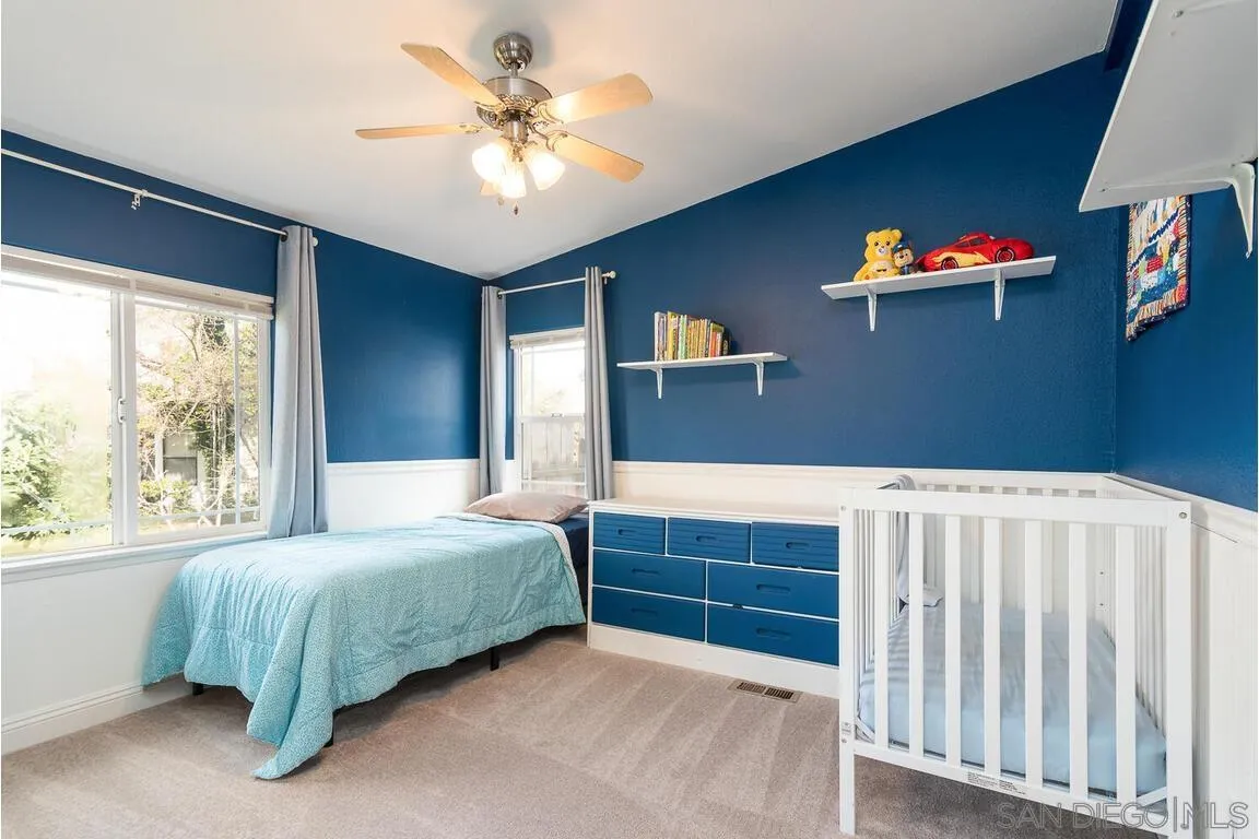 9399 Weber Court Spring Valley, CA 91977 - Photo 23 of 41 a bedroom with a bed and a chandelier