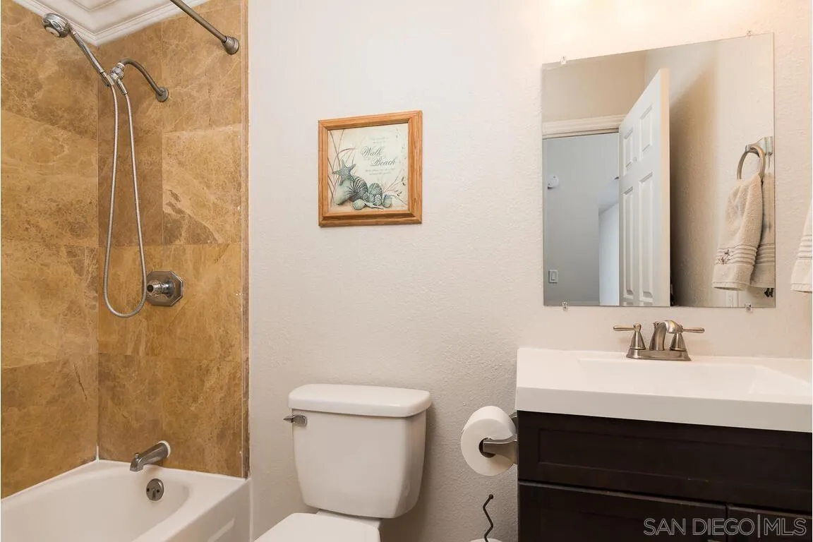 9399 Weber Court Spring Valley, CA 91977 - Photo 24 of 41 a bathroom with a sink a toilet and shower
