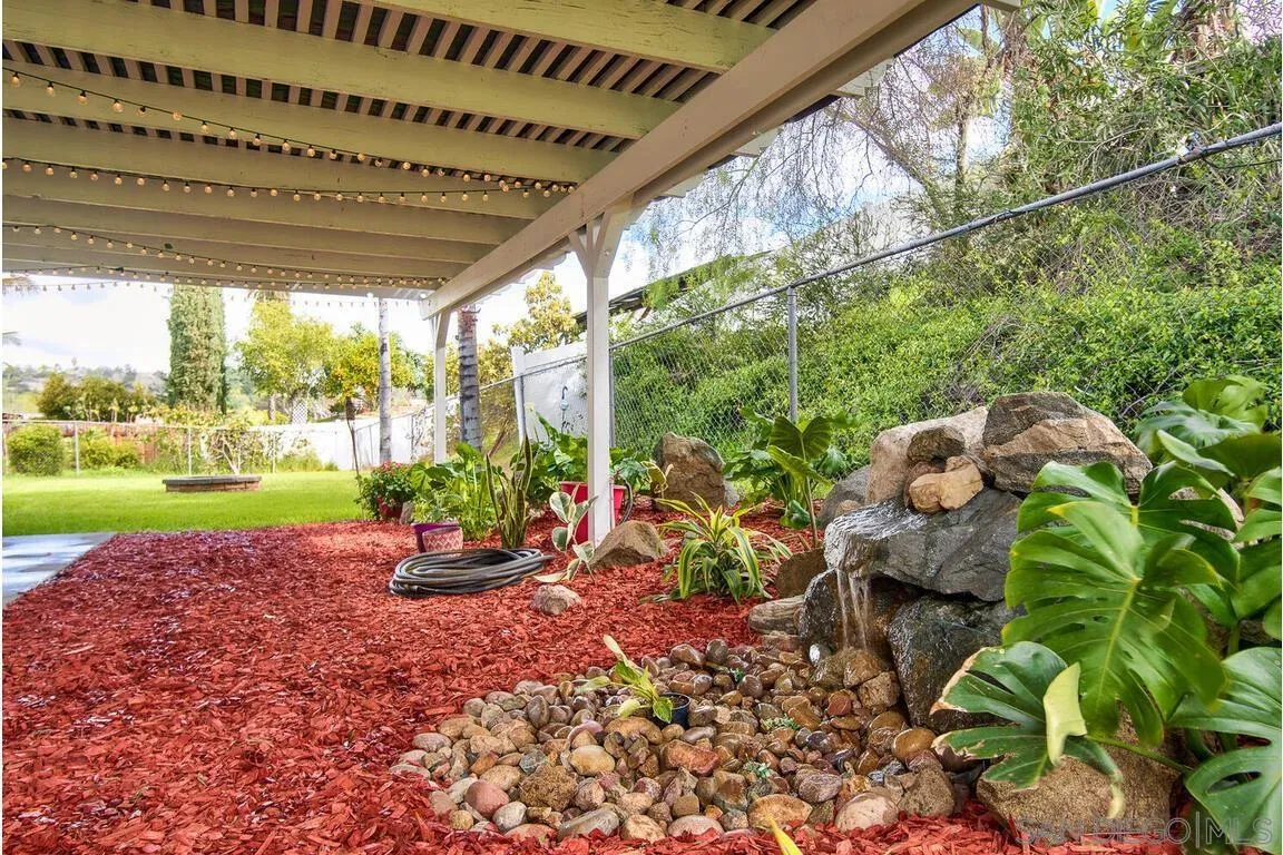 9399 Weber Court Spring Valley, CA 91977 - Photo 29 of 41 a view of a room with swing plants and large trees