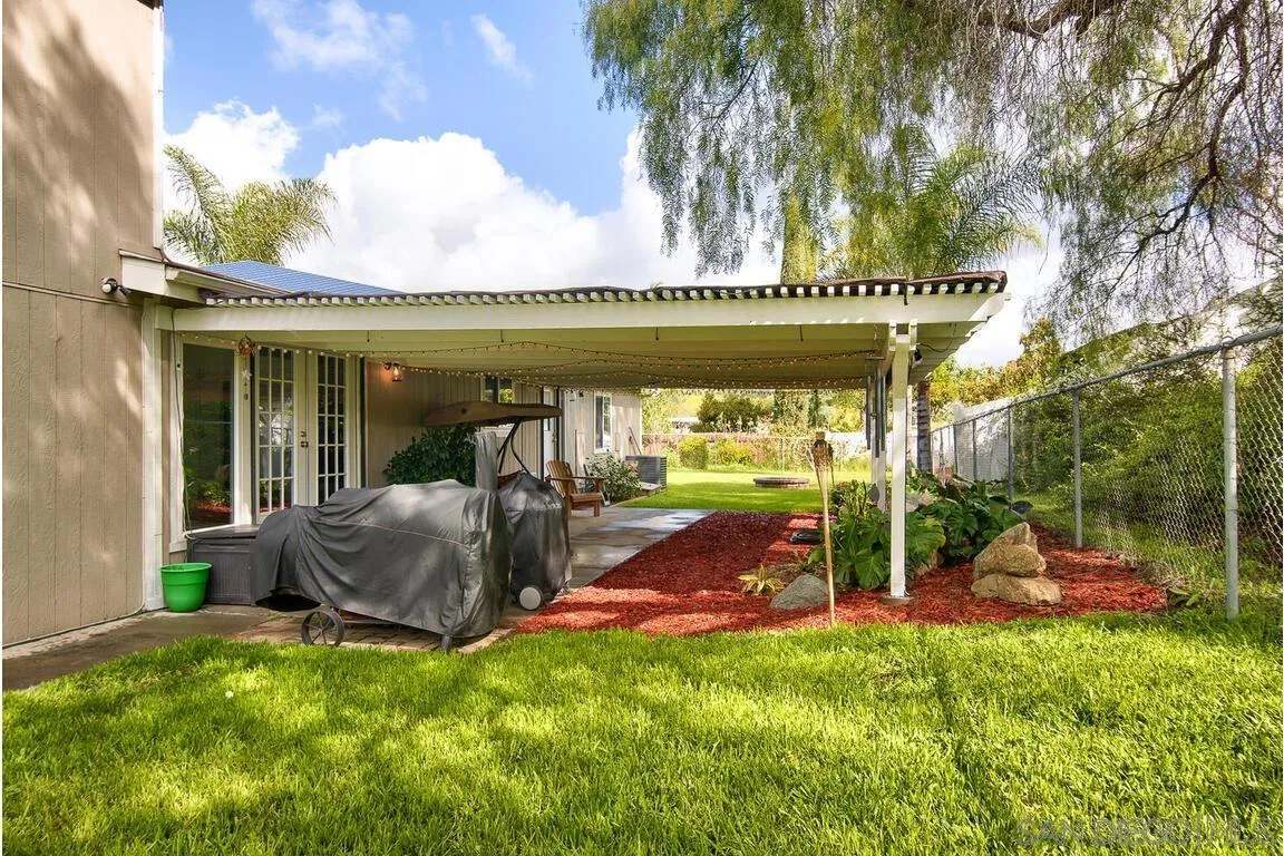 9399 Weber Court Spring Valley, CA 91977 - Photo 30 of 41 a view of a swimming pool with a patio and a yard
