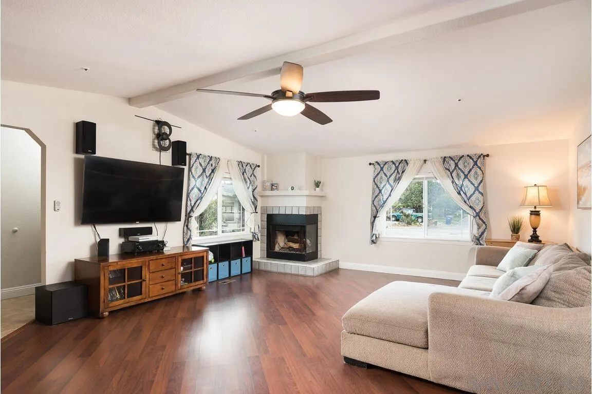 9399 Weber Court Spring Valley, CA 91977 - Photo 4 of 41 a living room with furniture fireplace and flat screen tv