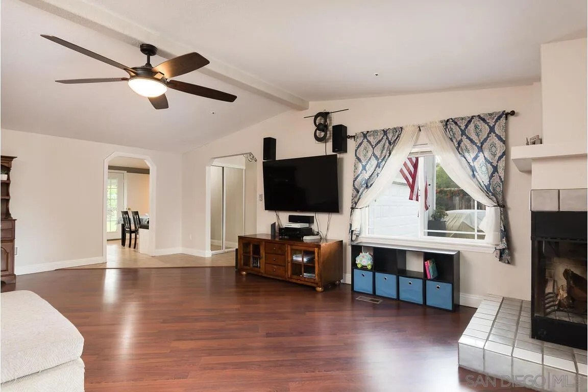 9399 Weber Court Spring Valley, CA 91977 - Photo 5 of 41 a living room with furniture and a flat screen tv