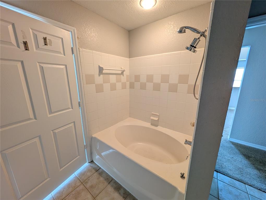 5531 Rosehill Road, Unit 203 Sarasota, FL 34233 - Photo 11 of 18 a bathroom with a sink and a shower