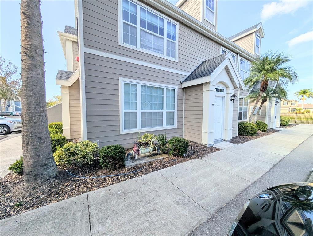 5531 Rosehill Road, Unit 203 Sarasota, FL 34233 - Photo 14 of 18 a front view of a house with garden