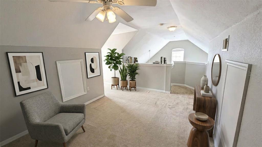 5531 Rosehill Road, Unit 203 Sarasota, FL 34233 - Photo 5 of 18 a living room with furniture and a chandelier