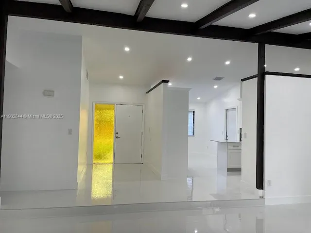 a bathroom with a tub and shower